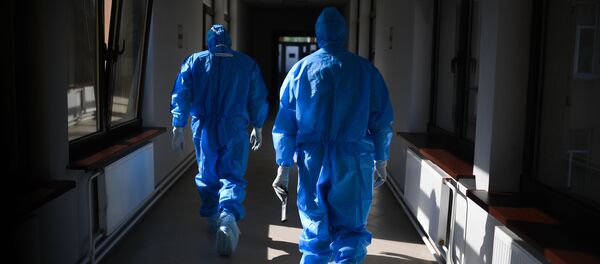 Врачи в госпитале для лечения зараженных коронавирусной инфекцией COVID-19 Врачи в госпитале для лечения зараженных коронавирусной инфекцией COVID-19 - Sputnik Ўзбекистон