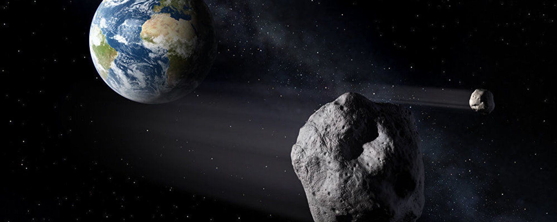 Астероид в космосе на фоне земли. Иллюстративное фото - Sputnik Ўзбекистон, 1920, 11.01.2021
