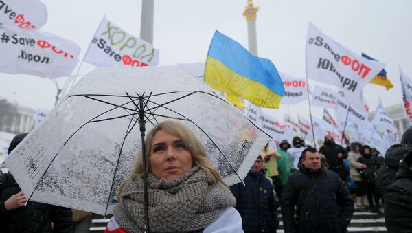 Участница всеукраинской акции за налоговые послабления для малого бизнеса на Майдане Незалежности в Киеве - Sputnik Узбекистан