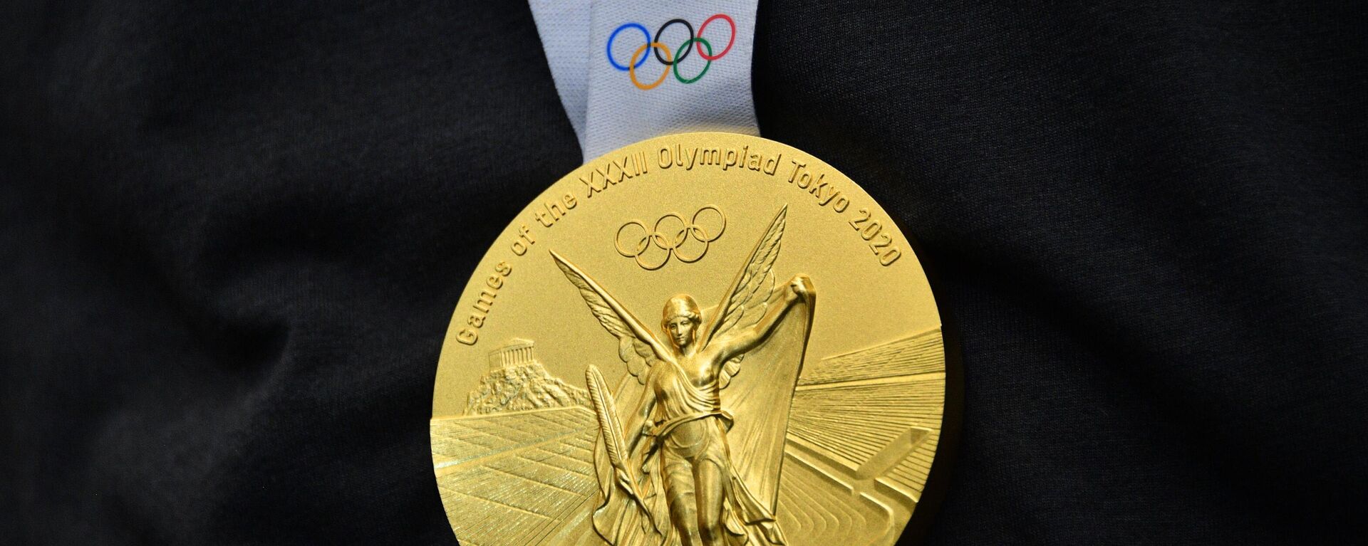 Золотая медаль на XXXII летних Олимпийских играх в Токио, - Sputnik Узбекистан, 1920, 02.08.2021