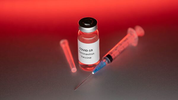 Ампула с вакциной от коронавируса, архивное фото - Sputnik Узбекистан