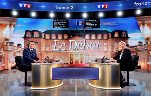 Fransiya prezidenti lavozimiga asosiy da’vogarlar Emmanuel Makron va Marin Le Pen telemunozaralar chog‘ida - Sputnik O‘zbekiston