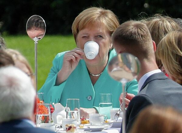 Germaniya kansleri Angela Merkel Berlinda Konstitutsiyaning 70-yilligiga bag‘ishlangan qabulda, 2019-yil 23-may. - Sputnik O‘zbekiston