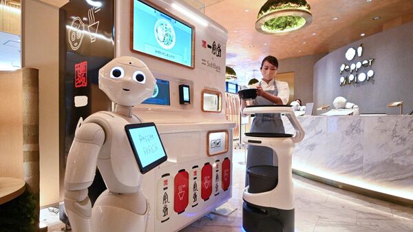 Роботы во время презентации Japan's SoftBank Robotics в Токио  - Sputnik Узбекистан