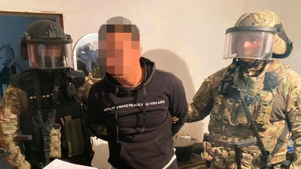 Лидера и членов ОПГ Бейнеуские задержали за вымогательство сотрудники КНБ - Sputnik Узбекистан