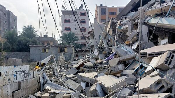 Здания, пострадавшие в результате ракетных ударов ВС Израиля по Газе. Архивное фото - Sputnik Узбекистан