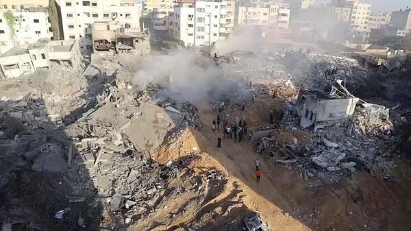 Последствия израильских ударов по жилым районам в Газе.  - Sputnik Узбекистан