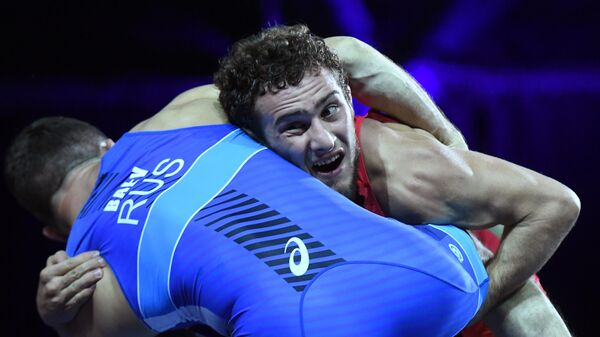 Разамбек Жамалов в финале соревнований по вольной борьбе в весовой категории до 74 кг. Архивное фото - Sputnik Узбекистан