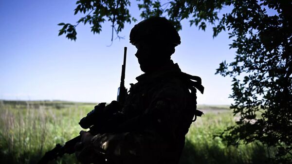 Российский военнослужащий в зоне спецоперации. - Sputnik Узбекистан