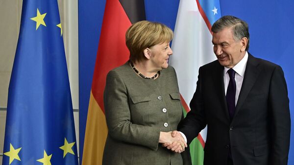 Shavkat Mirziyoyev i Angela Merkel - Sputnik O‘zbekiston