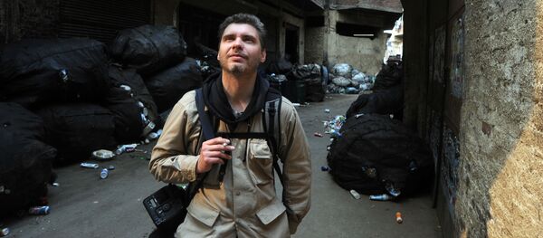 Фотокорреспондент Андрей Стенин на улице Каира - Sputnik Узбекистан