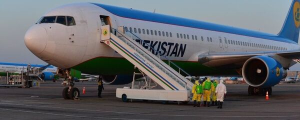 В Ташкент прилетел самолет с пассажирами из г. Ухань В Ташкент прилетел самолет с пассажирами из г. Ухань - Sputnik Ўзбекистон