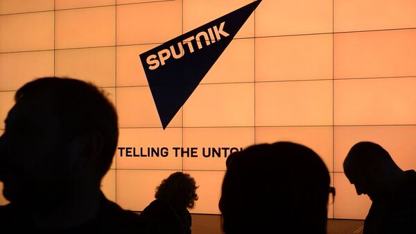 Логотип международного информационного бренда Спутник. - Sputnik Ўзбекистон