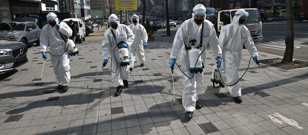 Дезинфекция от коронавируса COVID-19 на улицах южной Кореи, архивное фото - Sputnik Узбекистан