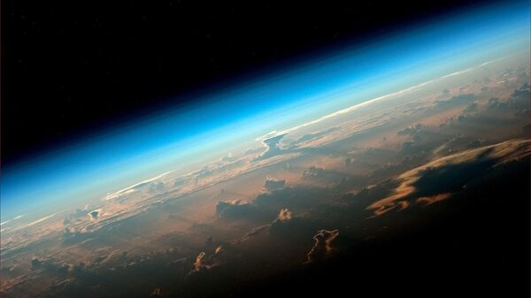 Вид на Землю с борта МКС снятый космонавтом Роскосмоса Олегом Артемьевым - Sputnik Узбекистан