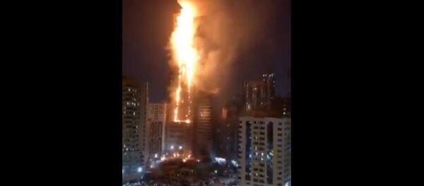 Massive Fire at Sharjah 50 storey building. Abbco Tower. Sharjah Dubai. Massive Fire at Sharjah 50 storey building. Abbco Tower. Sharjah Dubai. - Sputnik Ўзбекистон