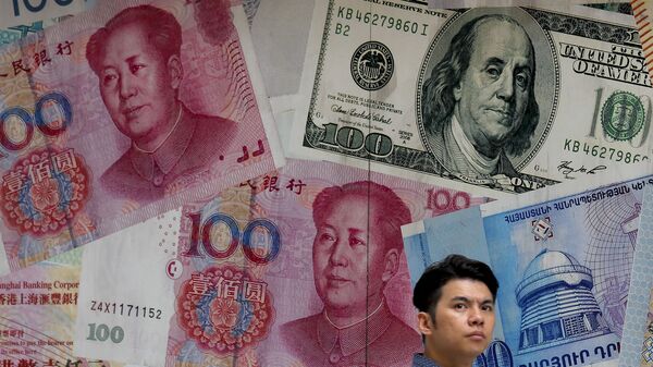  Dollar va yuan, arxiv surat - Sputnik O‘zbekiston