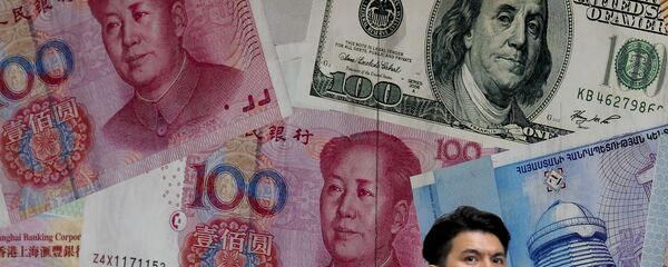 Американский длллар и юань Американский длллар и юань - Sputnik Ўзбекистон
