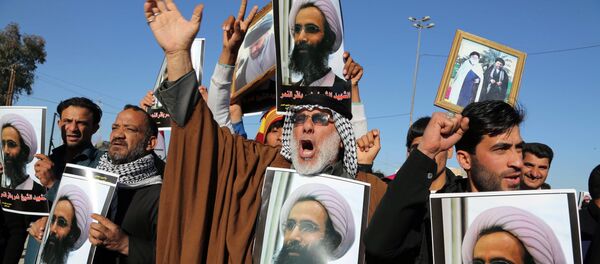 Ироқдаги шиа мусулмонларининг шайх Нимр ал-Нимр қатлига қарши намойиши. Ироқдаги шиа мусулмонларининг шайх Нимр ал-Нимр қатлига қарши намойиши. - Sputnik Ўзбекистон