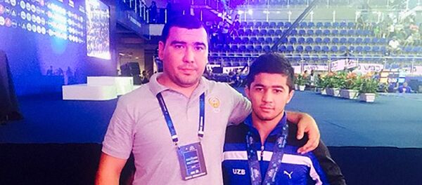 Узбекский борец греко-римского стиля Жавохир Мирахмедов (справа) Узбекский борец греко-римского стиля Жавохир Мирахмедов (справа) - Sputnik Узбекистан