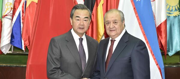 ХХР ТИВ раҳбари Ван И ва Ўзбекистон ТИВ раҳбари Абдулазиз Камилов - Sputnik Ўзбекистон