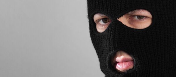 Человек в маске балаклавы. Архивное фото Человек в маске балаклавы. Архивное фото - Sputnik Ўзбекистон