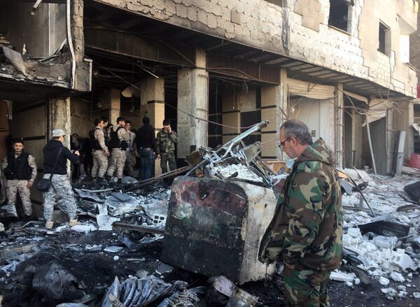 Последствия теракта в шиитском квартале Дамаска Последствия теракта в шиитском квартале Дамаска - Sputnik Узбекистан
