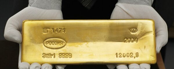 Золотой слиток  Золотой слиток  - Sputnik Ўзбекистон