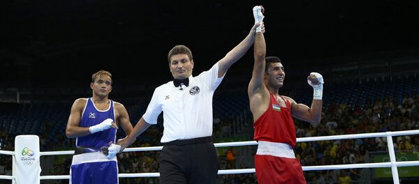 Узбекский боксер Шахобиддин Зоиров на Олимпиаде в Рио Узбекский боксер Шахобиддин Зоиров на Олимпиаде в Рио - Sputnik Узбекистан