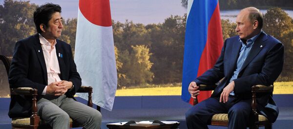 Путин ва Синдзо Абе Путин ва Синдзо Абе - Sputnik Ўзбекистон