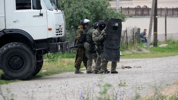 Сотрудники ФСБ во время спецоперации - Sputnik Узбекистан