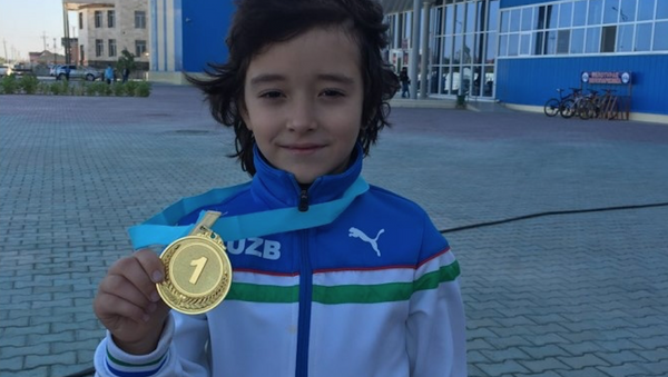 Семилетний хоккеист Салохиддин Азимов - Sputnik Узбекистан