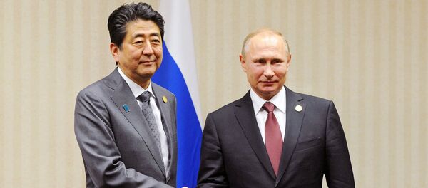 Владимир Путин и Синдзо Абэ - Sputnik Узбекистан