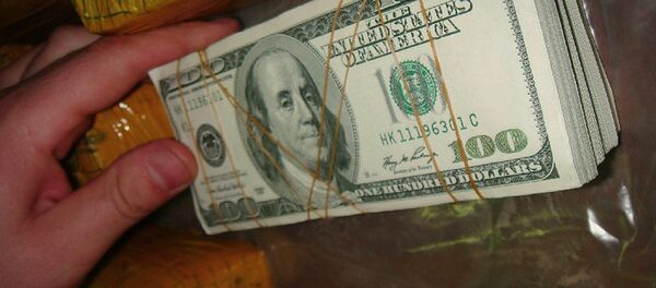 Доллары США изъятые правоохранительными органами Доллары США изъятые правоохранительными органами - Sputnik Ўзбекистон