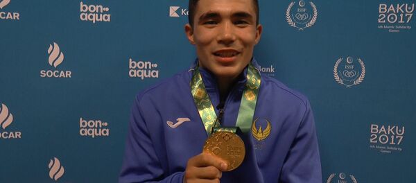 Узбекский боксер Шарахматов: свою золотую медаль дома надену маме Узбекский боксер Шарахматов: свою золотую медаль дома надену маме - Sputnik Ўзбекистон