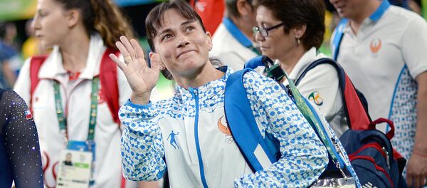 Оксана Чусовитина (Узбекистан) во время квалификационных соревнований по спортивной гимнастике на XXXI летних Олимпийских играх Оксана Чусовитина (Узбекистан) во время квалификационных соревнований по спортивной гимнастике на XXXI летних Олимпийских играх - Sputnik Ўзбекистон