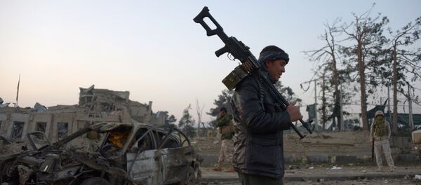 Сотрудник сил безопасности Афганистана Сотрудник сил безопасности Афганистана - Sputnik Ўзбекистон