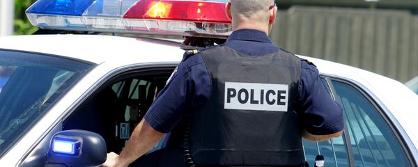 Сотрудник американской полиции Сотрудник американской полиции - Sputnik Ўзбекистон