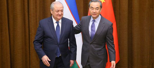 Глава МИД КНР Ван И и глава МИД Узбекистана Абдулазиз Камилов - Sputnik Узбекистан