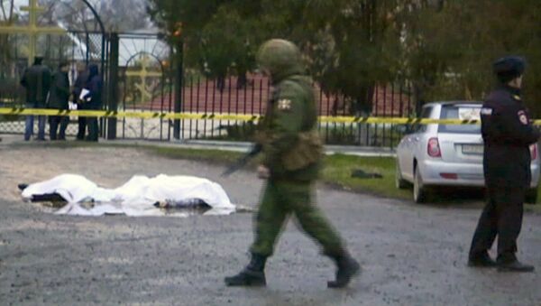 Скрин-шот с экрана, на котором изображены тела погибших при нападении на церковь в Кизляре - Sputnik Узбекистан