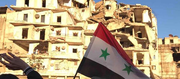 Жители Алеппо после вывода боевиков и членов их семей из восточного Алеппо - Sputnik Узбекистан