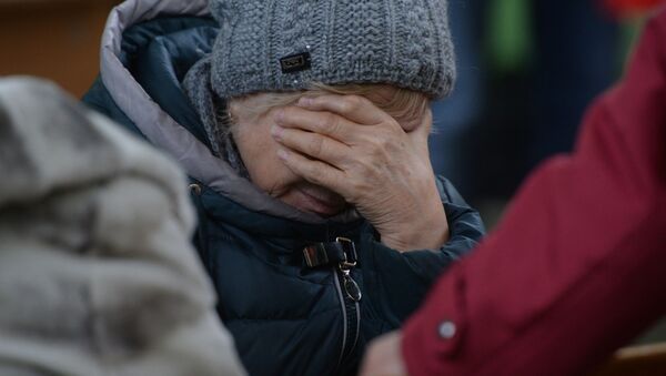 Родственница одного из пропавших без вести при пожаре в торговом центре «Зимняя вишня» в Кемерово - Sputnik Узбекистан