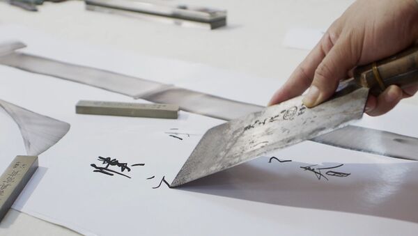 СПУТНИК_Китайский каллиграф рисует иероглифы поварскими ножами - Sputnik Узбекистан