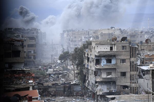 Разрушенные строения в районе бывшего лагеря палестинских беженцев Ярмук в южном пригороде Дамаска. - Sputnik Узбекистан
