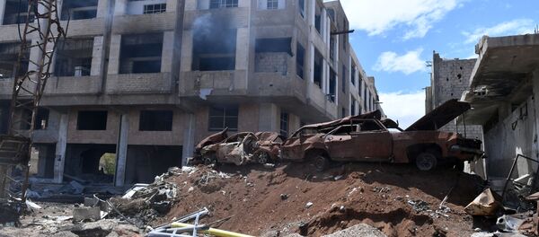 Razrushennie stroyeniya v rayone bivshego lagerya palestinskix bejensev Yarmuk v yujnom prigorode Damaska Razrushennie stroyeniya v rayone bivshego lagerya palestinskix bejensev Yarmuk v yujnom prigorode Damaska - Sputnik O‘zbekiston