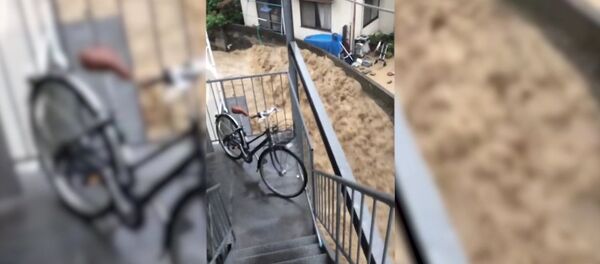 Ливни и наводнение в Японии Ливни и наводнение в Японии - Sputnik Ўзбекистон