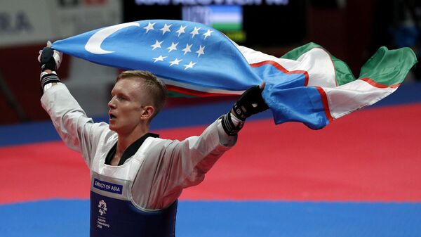 Тхэквондист Никита Рафалович принес сборной Узбекистана вторую золотую медаль Тхэквондист Никита Рафалович принес сборной Узбекистана вторую золотую медаль - Sputnik Узбекистан
